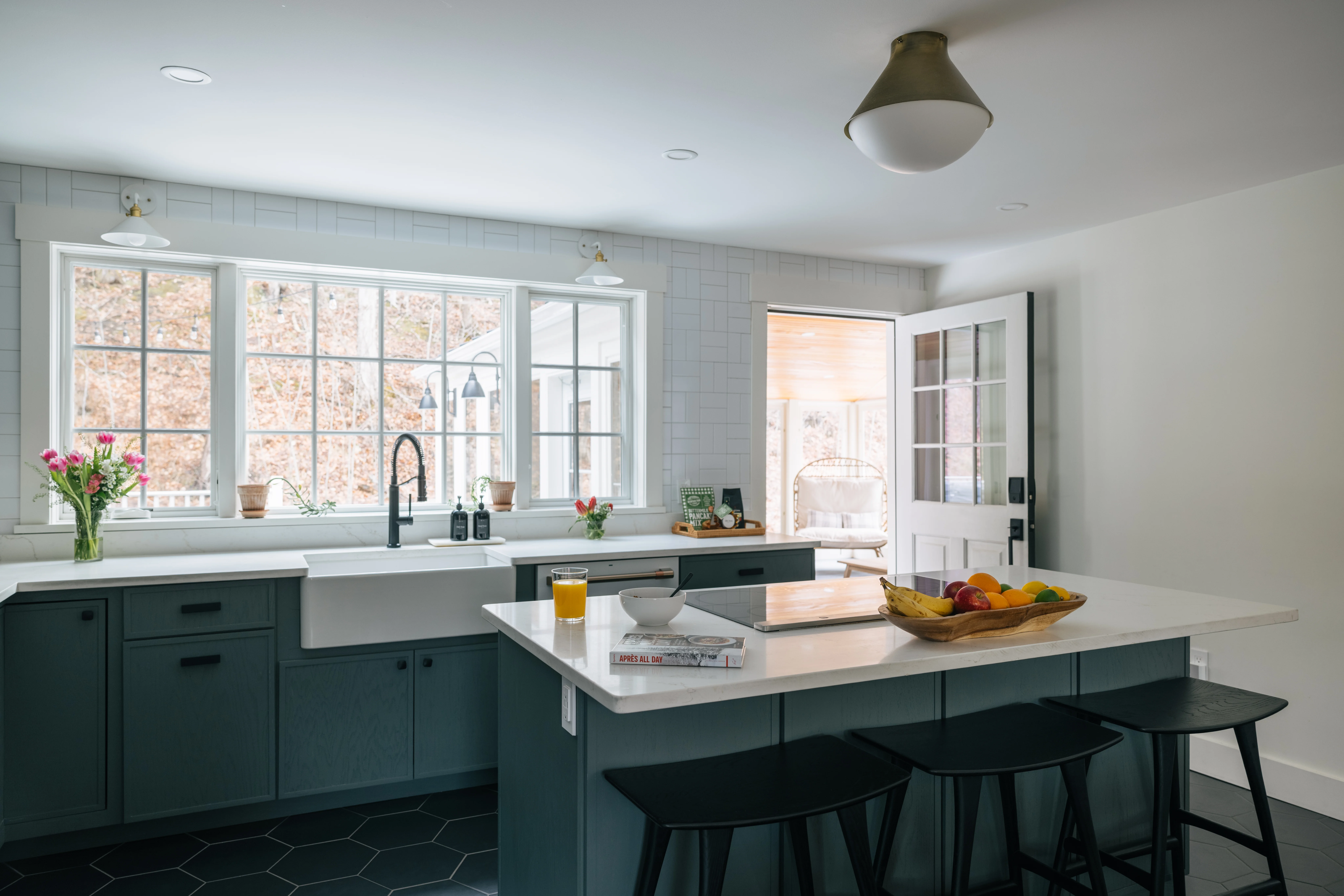 Kitchen 2026 update with fresh styling, green shaker cabinets, and bright natural light